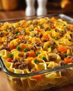 Delicious homestyle beef and cheddar egg noodle bake served in a casserole dish