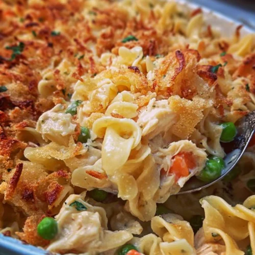 Baked easy chicken noodle casserole topped with crispy breadcrumbs.