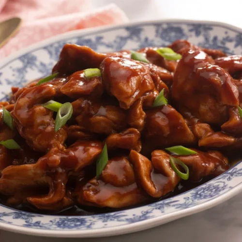 Delicious bourbon chicken served with a sweet and tangy sauce over rice.