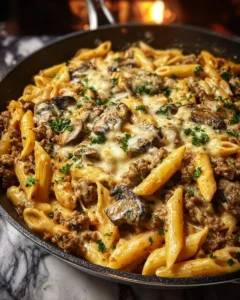Cheesy Beef Stroganoff Penne in Velveeta Sauce served in a bowl