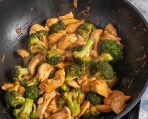Delicious chicken and broccoli stir fry with vibrant vegetables and savory sauce.