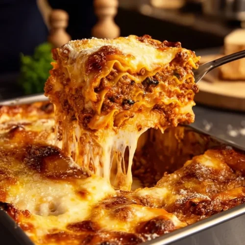 Delicious classic beef lasagna with layers of pasta, ground beef, and cheese