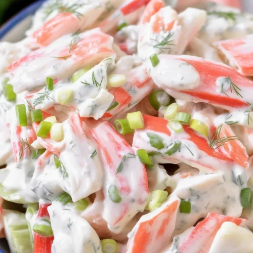 Delicious crab salad recipe with imitation crab, celery, and creamy dressing.