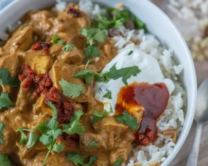 Delicious homemade chicken curry served with coconut milk and spices.
