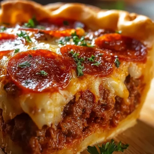 Delicious deep hamburger pie topped with sausage and pepperoni