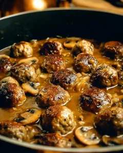 Plate of gourmet meatballs served with creamy mushroom sauce