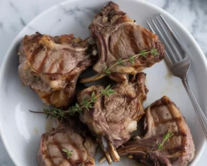 Garlic and rosemary marinated lamb chops ready to be cooked in the oven.