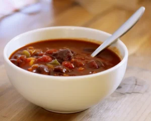 Delicious homemade Wendy's chili recipe with ground beef and beans in a savory broth.
