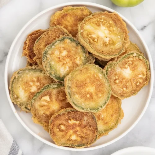 Crispy fried green tomatoes on a plate, the perfect Southern recipe