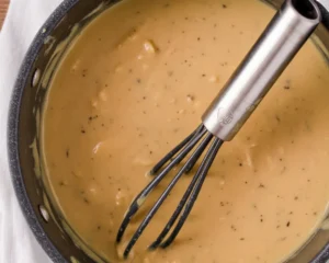 Homemade chicken gravy recipe with simple ingredients including butter, flour, and chicken broth.