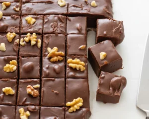 Delicious Fantasy Fudge made with chocolate chips, walnuts, and marshmallow creme.