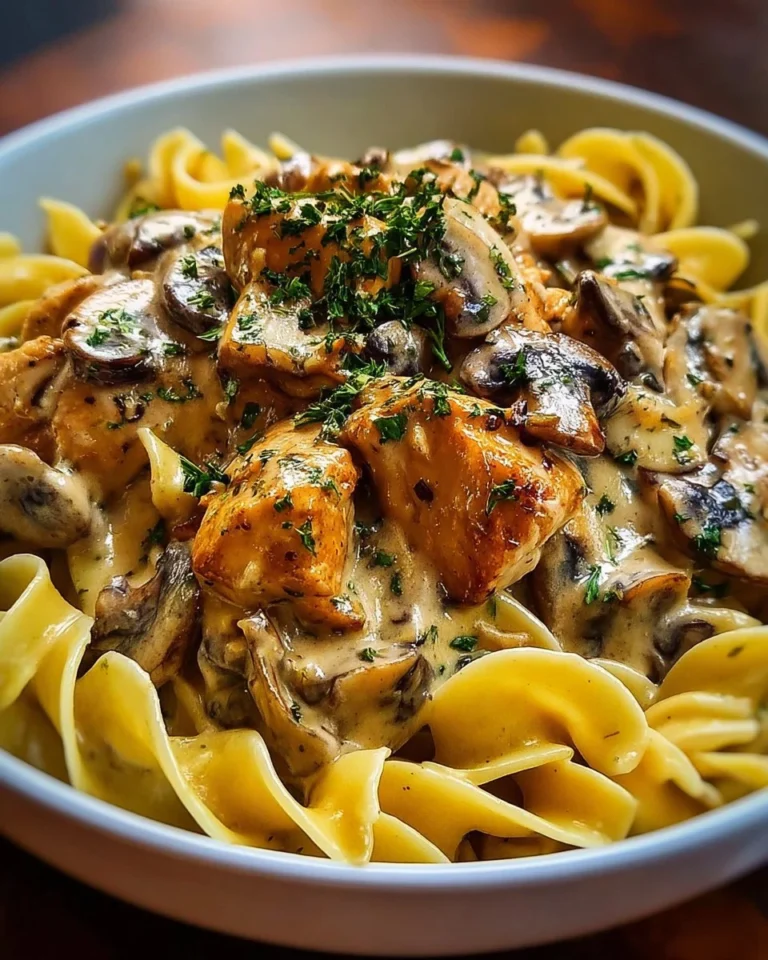 Creamy Chicken Mushroom Stroganoff served with pasta and fresh herbs