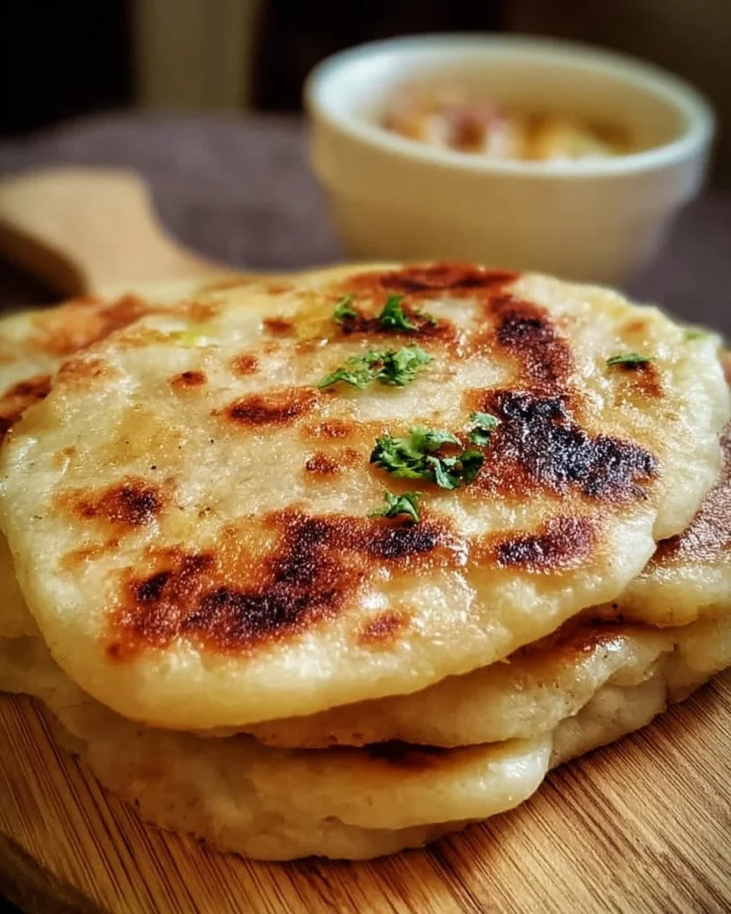 A plate of easy homemade pupusas with toppings and sides