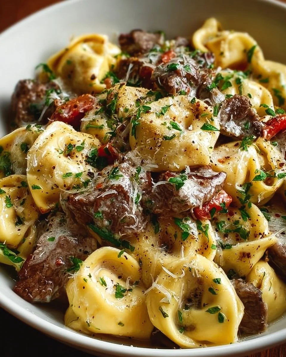 Philly Cheesesteak Tortellini Pasta dish with peppers and cheese