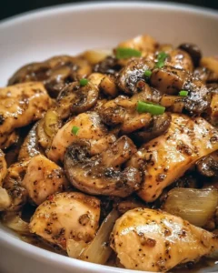 Delicious black pepper chicken stir-fry with mushrooms on a plate