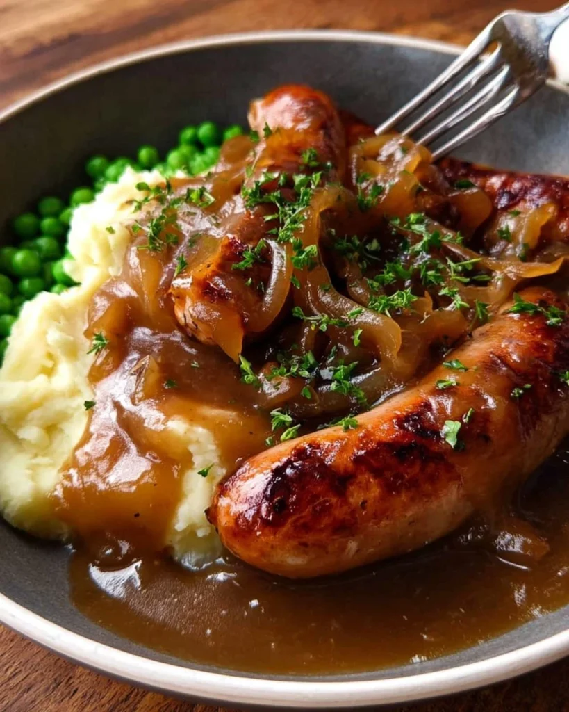 Bangers and mash: sausages served with creamy mashed potatoes and rich onion gravy