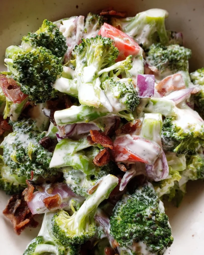 Delicious broccoli salad with lighter creamy dressing served in a bowl