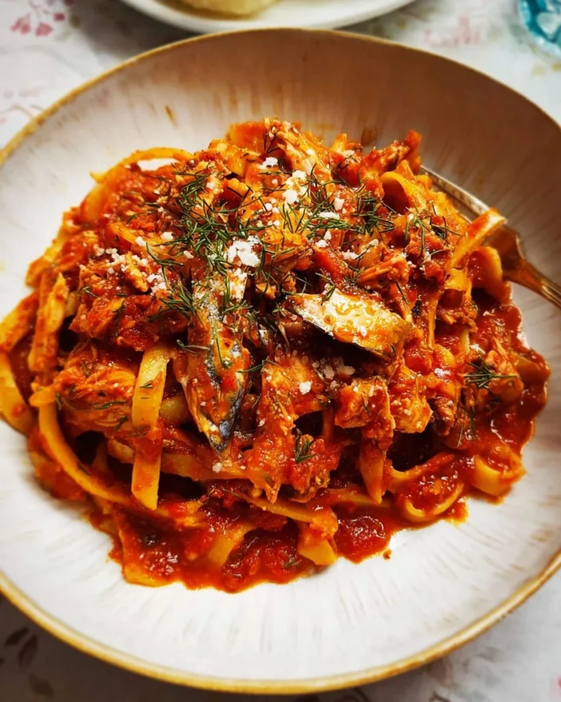 Delicious Calabrian Fish Ragu Pasta garnished with fresh herbs