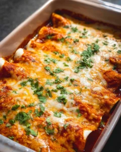 Delicious Chicken Enchiladas served with cheese and toppings on a plate