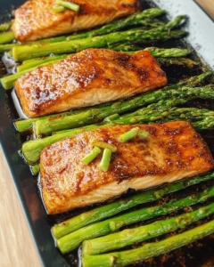 Delicious Hoisin Salmon served with crispy asparagus on a plate
