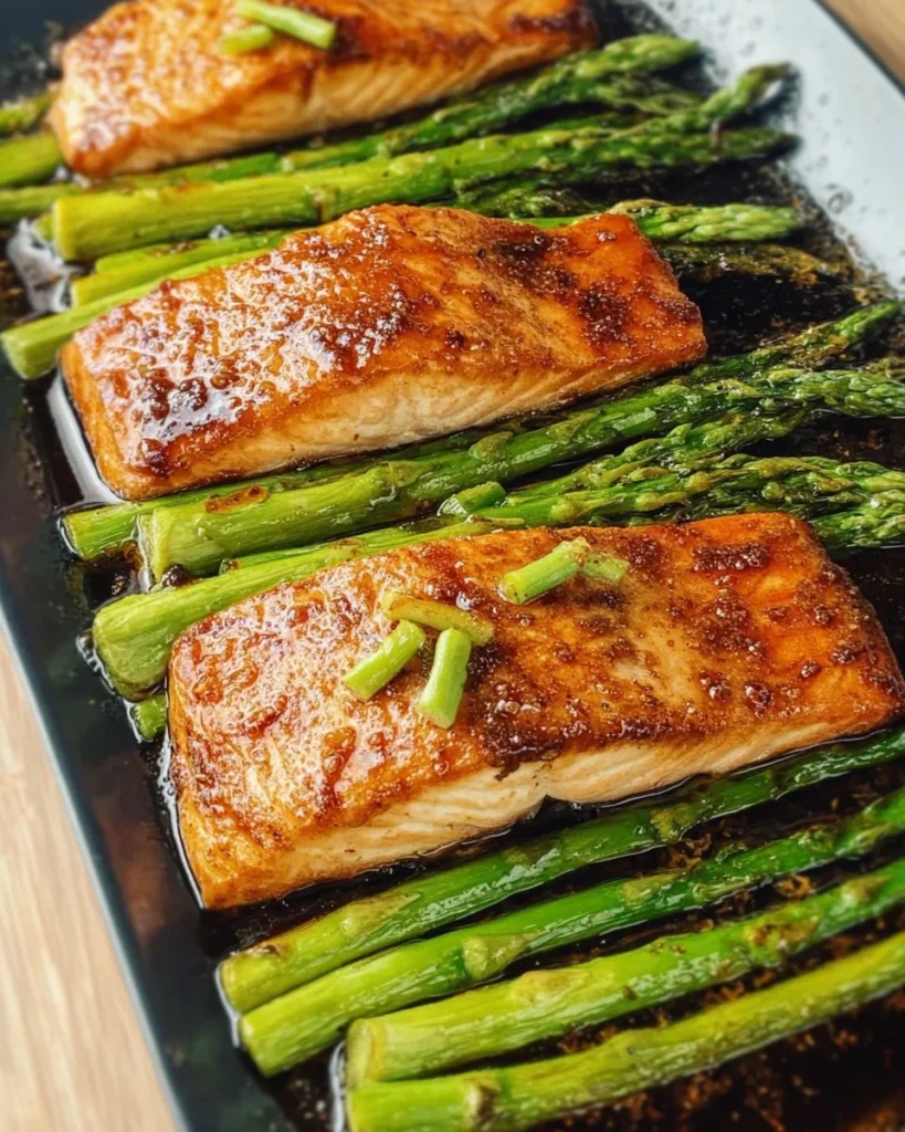 Delicious Hoisin Salmon served with crispy asparagus on a plate