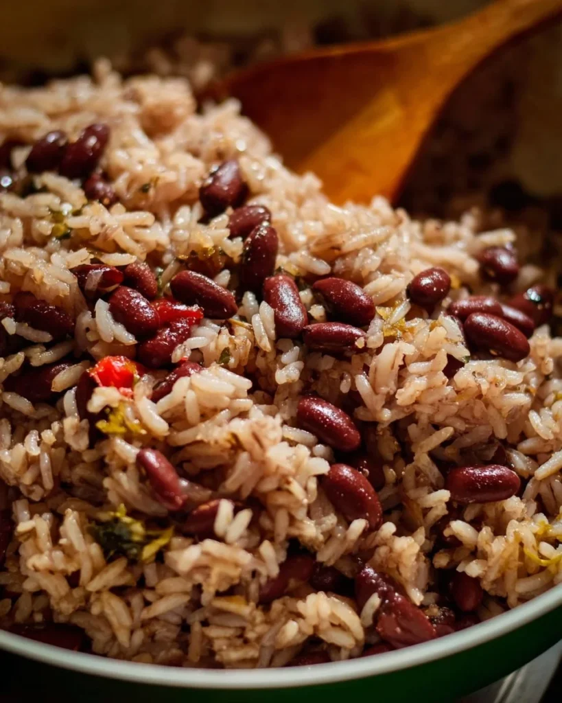 Bowl of Jamaican Rice and Peas garnished with fresh herbs