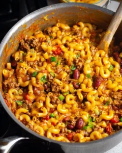 One Pot Chili Mac dish served in a bowl with cheese and herbs