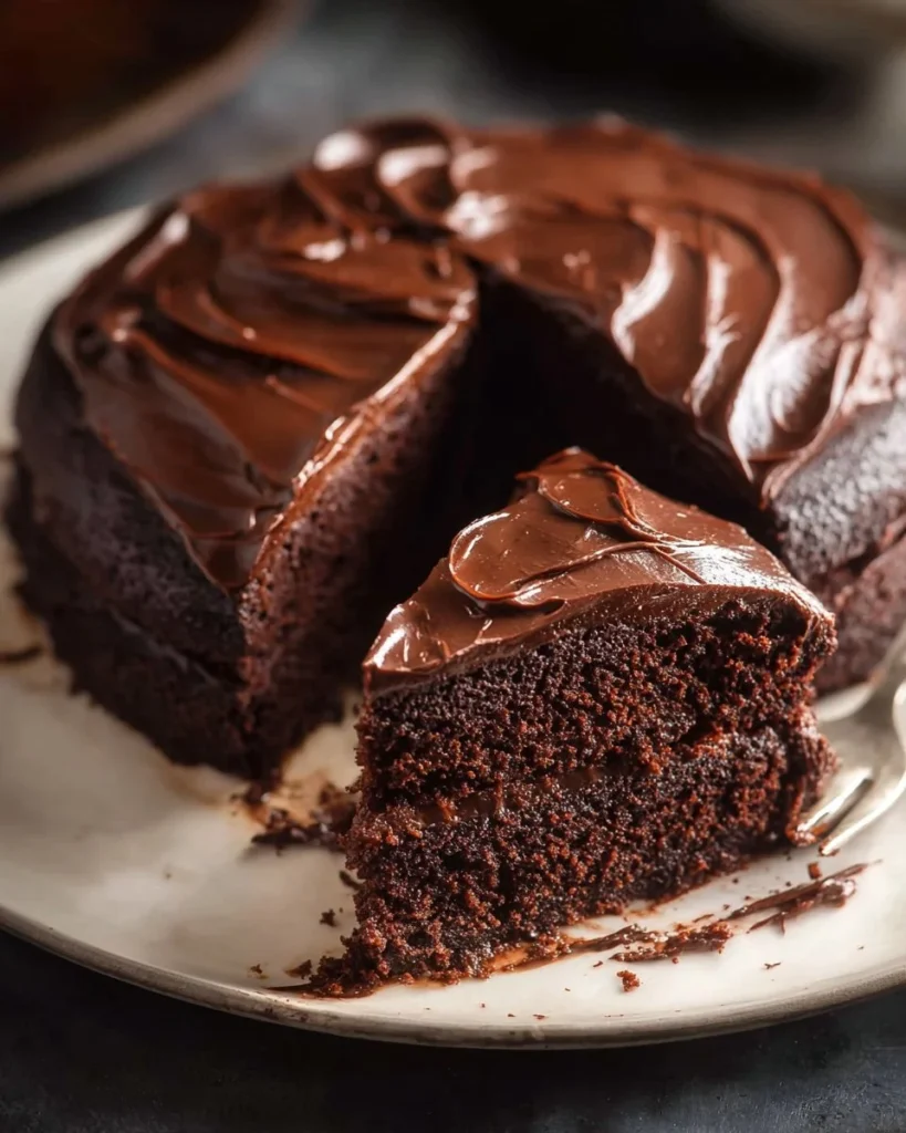 Easy chocolate fudge cake with rich chocolate frosting and decorations
