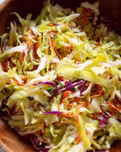 Bowl of vibrant Everyday Cabbage Salad featuring fresh veggies