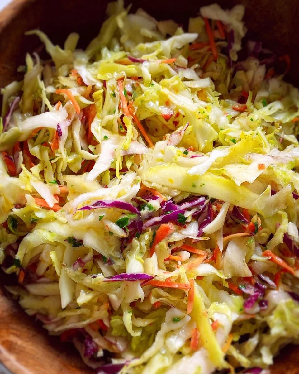 Bowl of vibrant Everyday Cabbage Salad featuring fresh veggies