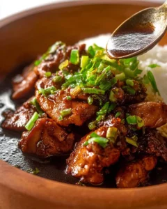 Delicious Filipino Chicken Adobo dish with rich, savory flavors.