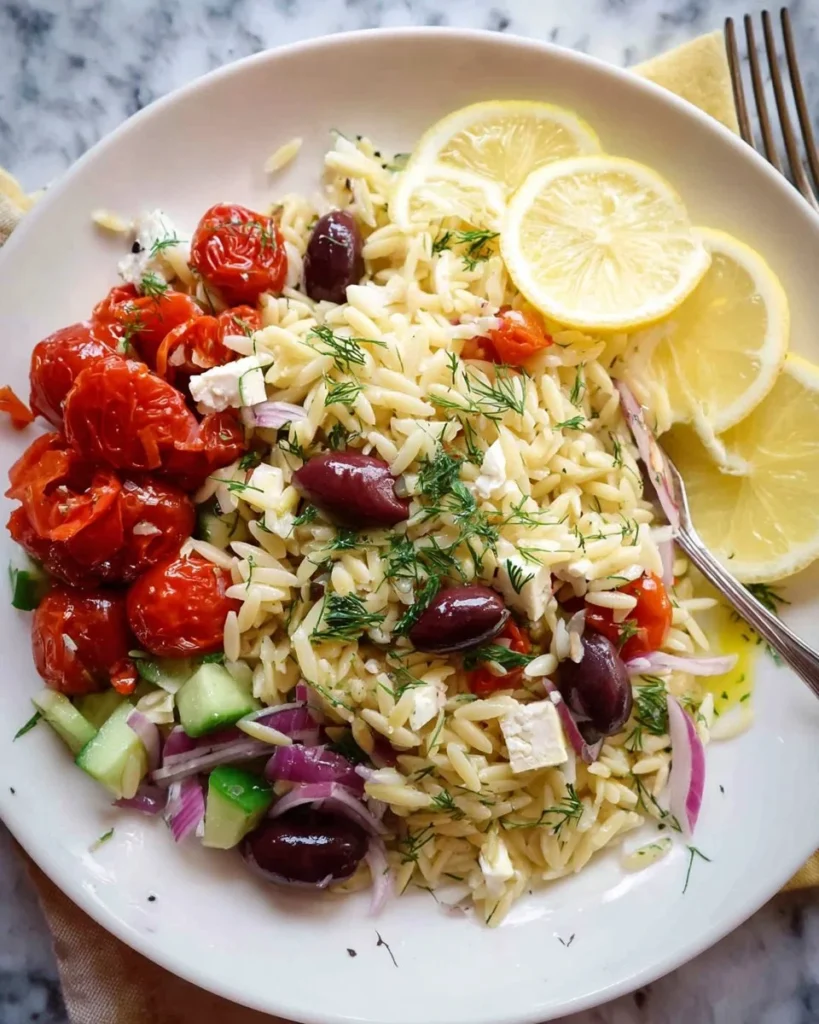 Bowl of Greek Lemon Orzo Salad with fresh ingredients and vibrant colors