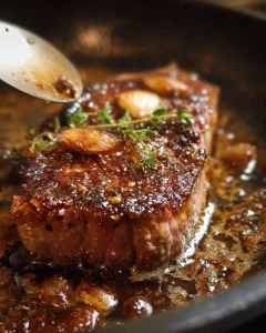 Chef cooking a perfectly seared steak on a grill