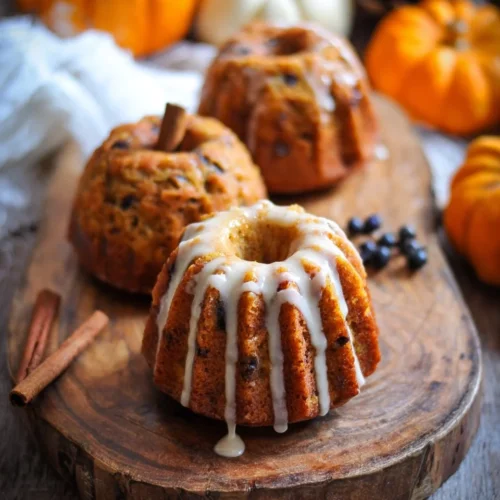Mini Pumpkin Bundt Cakes topped with a creamy cinnamon glaze