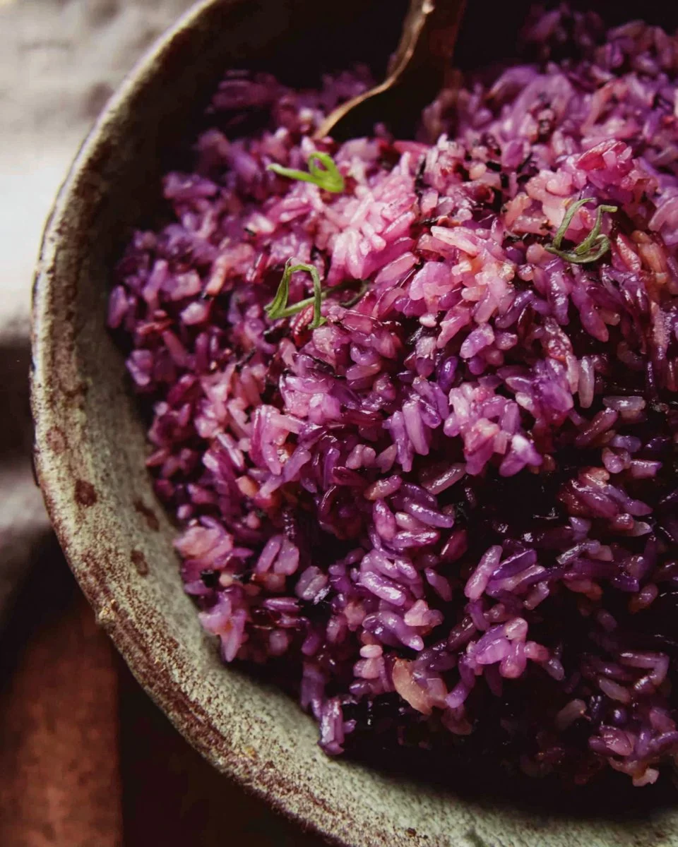 Plate of cooked purple rice showcasing its vibrant color and nutritional value.
