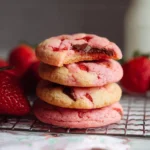 Freshly baked strawberry cookies with a vibrant pink hue