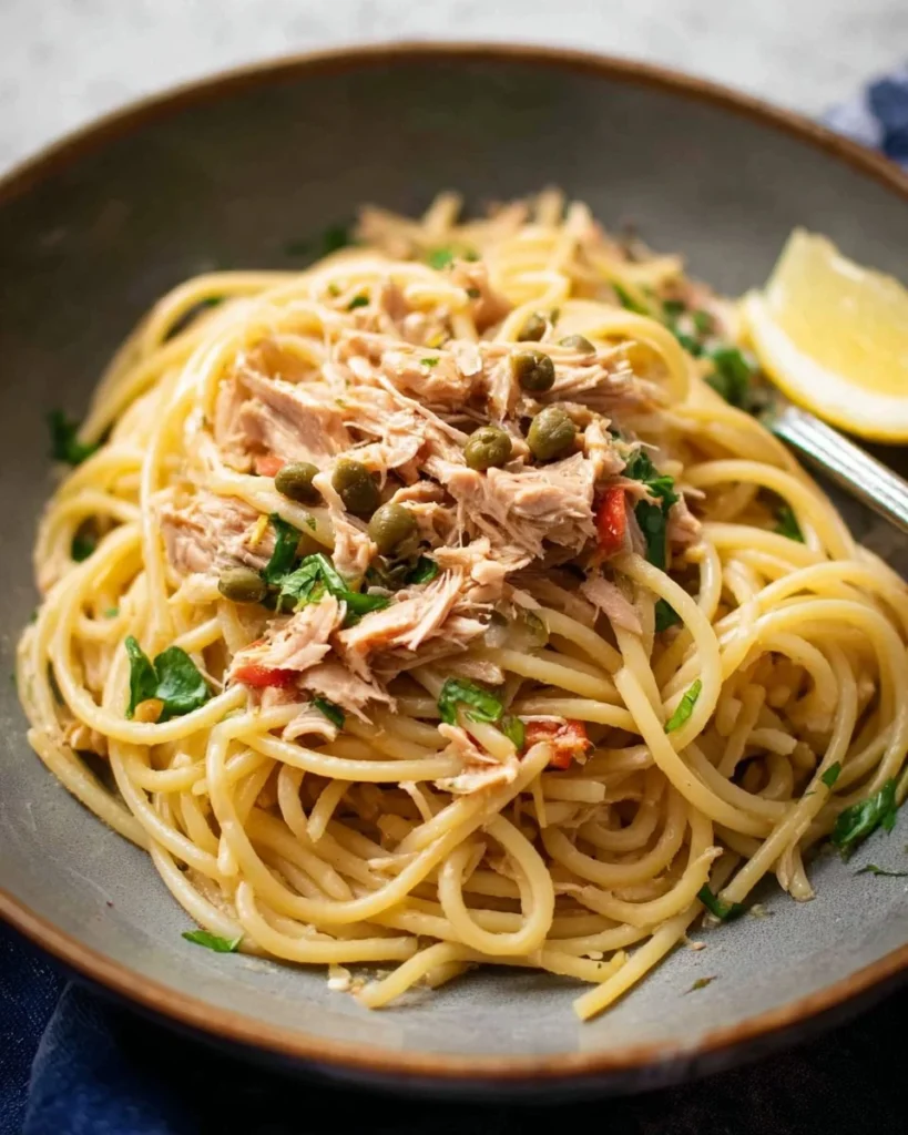 Delicious plate of canned tuna pasta garnished with herbs