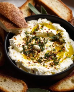 Creamy whipped feta dip served with colorful vegetables and crackers