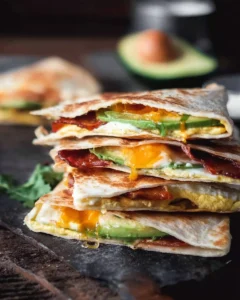 Whole Egg, Bacon, and Avocado Quesadilla served on a plate