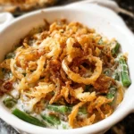 Delicious homemade green bean casserole topped with crispy onions and cheese