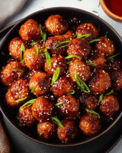 Plate of honey garlic meatballs glazed with a sweet sauce