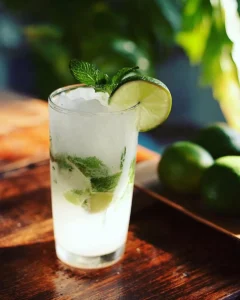 Refreshing Coconut Mojito cocktail served with mint and lime