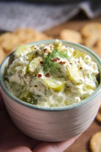 Delicious homemade pickle dip served with crackers and vegetables