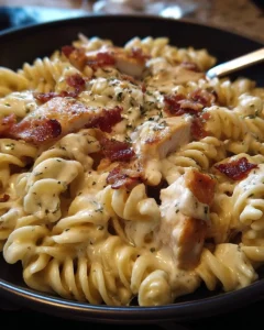 Delicious Chicken Bacon Ranch Pasta served in a bowl with fresh herbs