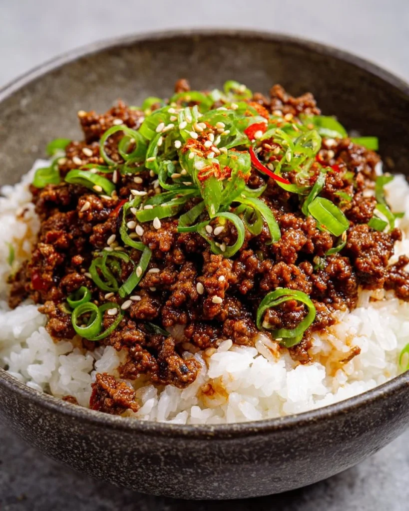 Delicious Korean ground beef served with rice and vegetables.