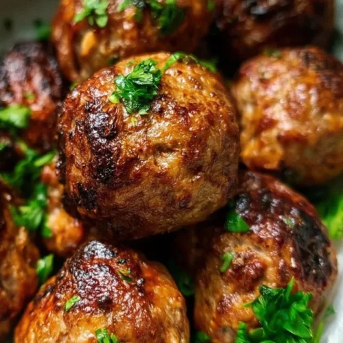 Air Fryer Meatballs (Juicy Lean Beef) 2 Crispy air fryer meatballs served with marinara sauce and herbs