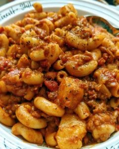 A hearty bowl of Chili Mac with beans, pasta, and melted cheese