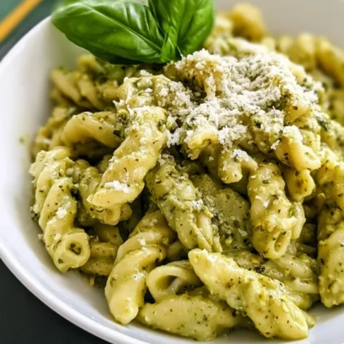 Quick Pesto Cream Pasta (20 Minutes) 3 Quick pesto cream pasta with Parmesan and fresh basil in a bowl