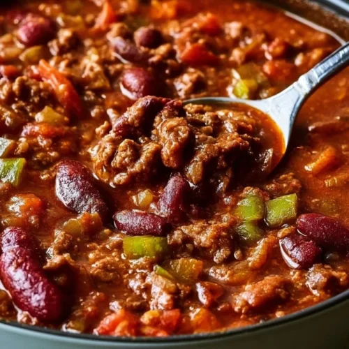 Easy Classic Chili 2 Bowl of classic chili topped with cheese and cilantro, serving as the ultimate comfort food.