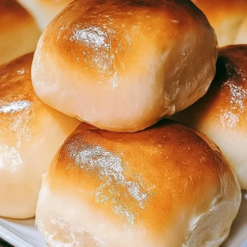 Fluffy Homemade Dinner Rolls 2 Fluffy homemade dinner rolls in a baking pan